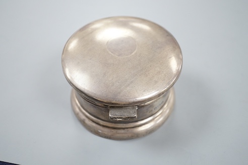 A George VI part engine turned silver circular powder box, A&J Zimmerman, Birmingham, 1937, 9cm.